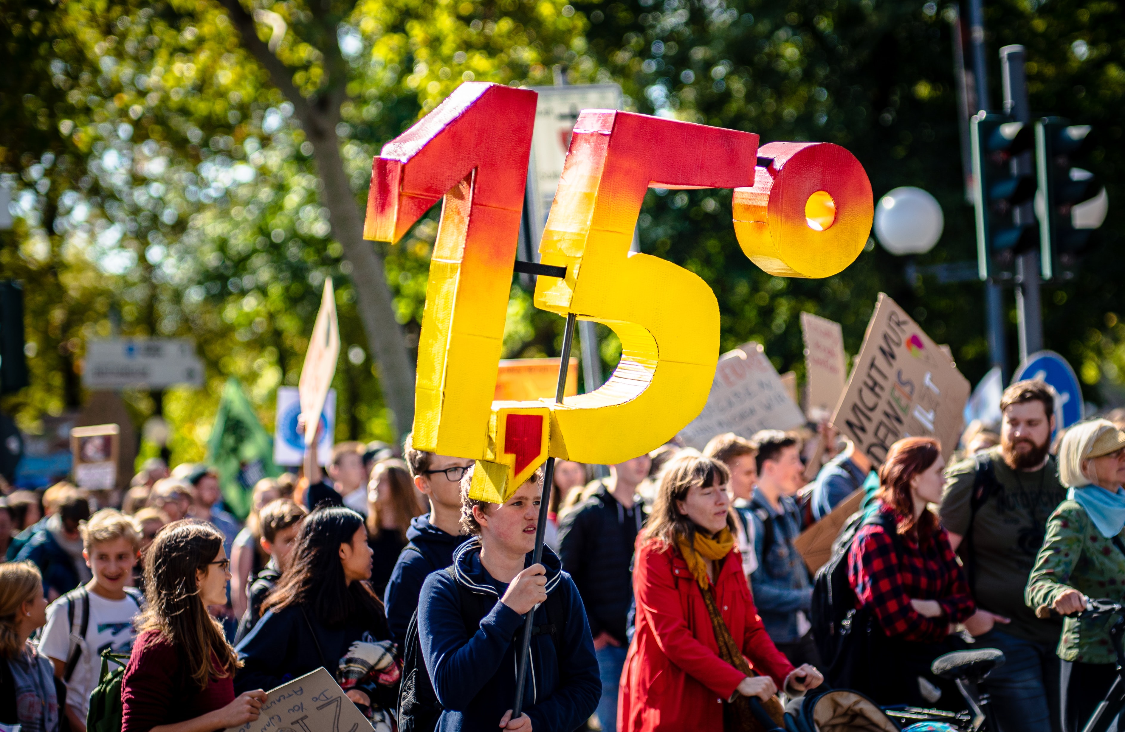 Climate change protest with 1.5 degree placard